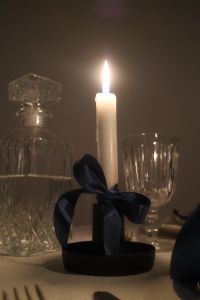 Kaboompics - Elegant Candlelit Table: Crystal Glassware - Satin Bows & Glowing Candles