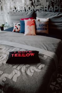 Scandinavian decorative pillows on modern bed