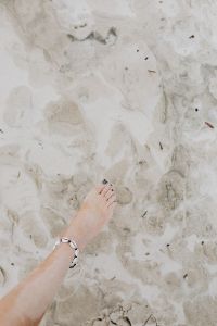 female foot on the beach