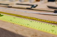 Close-ups of rulers on a wooden table
