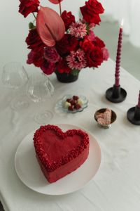 Kaboompics - Wine Glasses with Red Ribbon Accents - Heart-Shaped Cake - Red Flowers