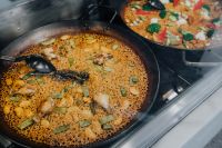 Top view of typical spanish chicken paella in traditional pan