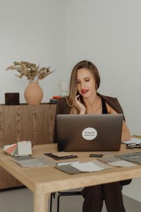 Kaboompics - Young entrepreneur dressed in brown suit - desk - laptop - computer