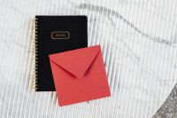 Kaboompics - Red envelope & on marble