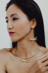 Beautiful Asian woman wears massive gold handmade jewelry