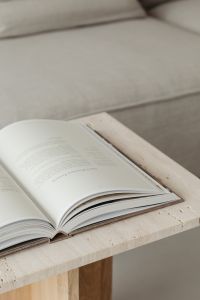 Kaboompics - The book lies on a travertine table