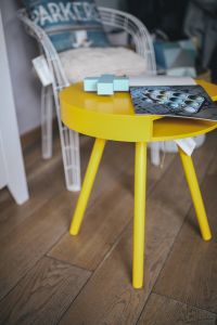 Kaboompics - Designer magazine on a yellow table