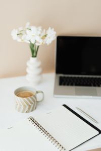 Kaboompics - Laptop - white flowers - organizer & cup of coffee on marble table