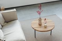 Kaboompics - Wooden coffee table - rug - living room - candle - vase - linen couch - pillows