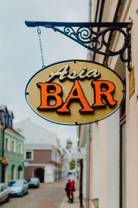 Photos from a walk around Zamość, Poland. Signboard Asian Bar.