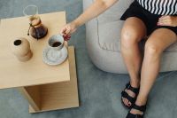 Kaboompics - Woman - legs - coffee cup - concrete floor - table - Chemex