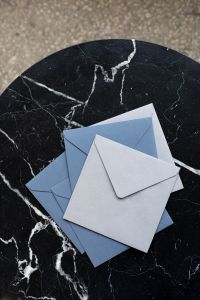 Kaboompics - Blue & white envelopes on marble