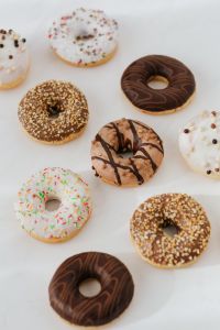 Various donuts on white marble