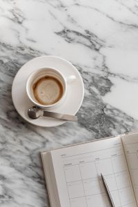 Kaboompics - Coffee in a cup - Calendar - Arabescato marble - Metal spoon