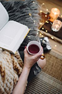 Kaboompics - Woman drinking tea and reading book