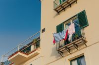 Kaboompics - Typical Italian balcony in an old house with drying laundry