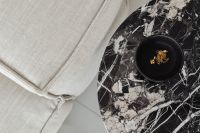 Kaboompics - Marble side table - round - greige linen sofa - cement floor - jewelry - gold chain