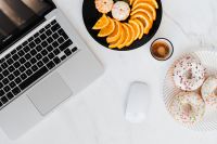 Kaboompics - Macbook Laptop, donuts, fruit & coffee