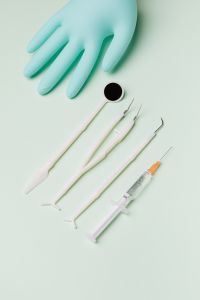 Disposable dental tools - a mirror probe, tweezers, syringe