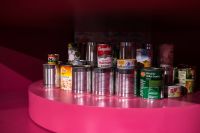 Kaboompics - Arrangement of tin cans on a pink background