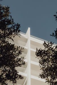 White minimalist building with metal railings