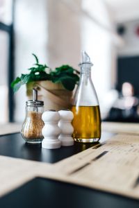 Kaboompics - Salt, pepper, olive oil and a plant