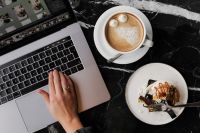 Kaboompics - Coffee and Cake with Laptop on Marble Table – Cozy Workspace Background