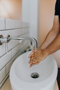 Washing of hands under running water