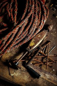Old rope with rusty tools