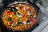 Top view of typical spanish vegetables paella in traditional pan