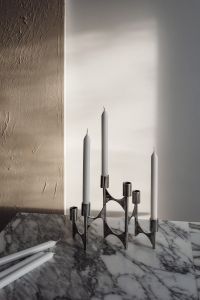 Kaboompics - Arabescato Marble Table - Metal Candleholder - White Candles