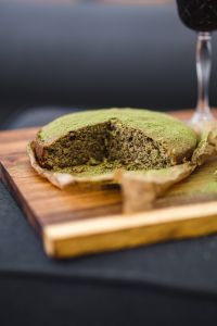 Delicious homemade matcha cake on a wooden board