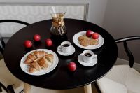 Kaboompics - Breakfast served with coffee, croissants, cookies and plums