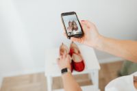 Kaboompics - Woman takes photos of products she will sell online - red shoes