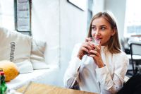Kaboompics - Beautiful woman having coffee at cafe