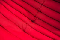 Red fabrics stacked together