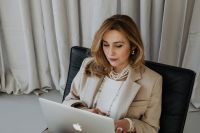 Kaboompics - A very elegant and sophisticated woman at work in front of a laptop