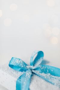 Christmas gift with blue ribbon