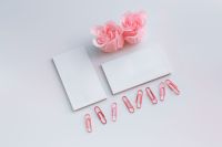 Kaboompics - Little sheets of paper with pink paper clips