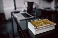 Kaboompics - Close-up of golden journals in the office