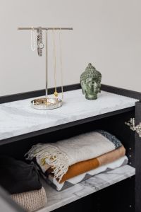 Kaboompics - Jewellery stand on marble shelf