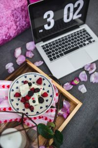 Kaboompics - Summer berries with a sweet dessert on a plate in a drawer and a laptop