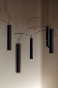 Minimalist black pendant lights with an artistic wire arrangement