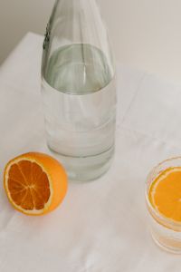 Kaboompics - Fresh juicy oranges - a glass and a bottle of water