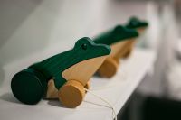 Small wooden frogs with string