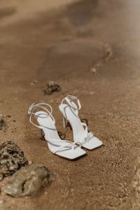 Kaboompics - White high-heel thin-strap sandals - Buckle closure on the ankle strap
