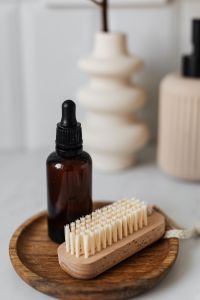 Kaboompics - Bottle with essential oil - wooden nail brush