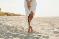 Kaboompics - Young stylish woman poses on the beach at sunset