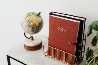 Kaboompics - Planner on The White Marble Table, White Background, Pilea, Globe