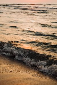 Sea waves by sunset
